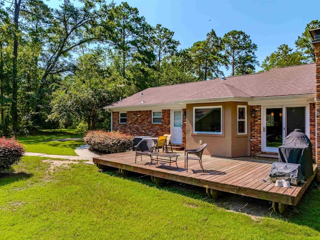 1178 Robin Kay Rd, Tallahassee, FL 32312 - rear view of property with a lawn, a deck, stucco siding, and roof with shingles