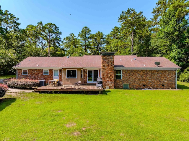 1178 Robin Kay Rd, Tallahassee, FL 32312 - back of house featuring a deck, a lawn, a chimney, crawl space, and brick siding
