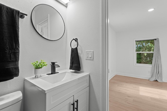 715 Caliark St, Tallahassee, FL 32304 - bathroom featuring vanity, wood finished floors, recessed lighting, and a textured wall