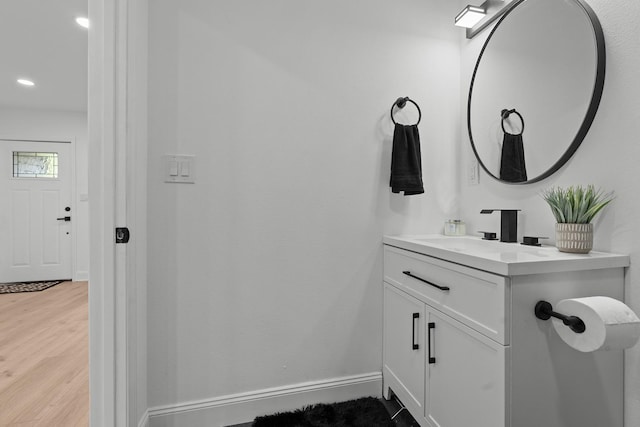 715 Caliark St, Tallahassee, FL 32304 - bathroom featuring vanity, wood finished floors, and recessed lighting