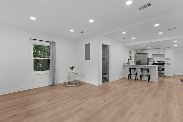 715 Caliark St, Tallahassee, FL 32304 - living room featuring electric panel, recessed lighting, and light wood finished floors