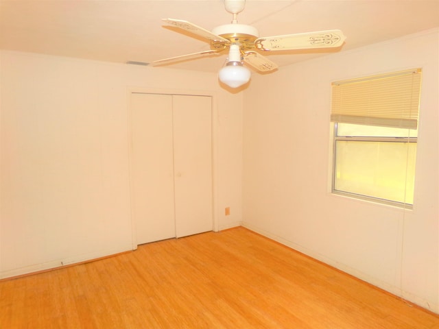 906 NE 1st St, Havana, FL 32333 - empty room with a ceiling fan and light wood-style floors