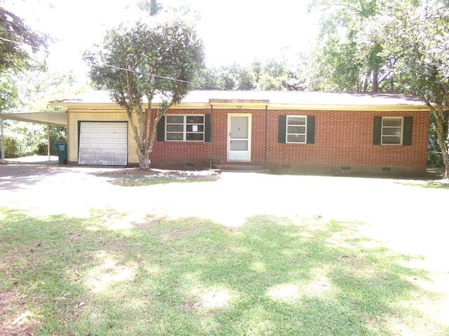 906 NE 1st St, Havana, FL 32333 - single story home with crawl space, a garage, driveway, an attached carport, and brick siding