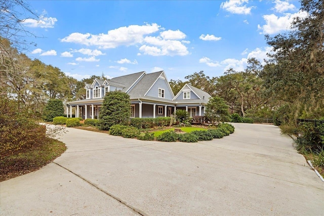 view of property exterior featuring covered porch