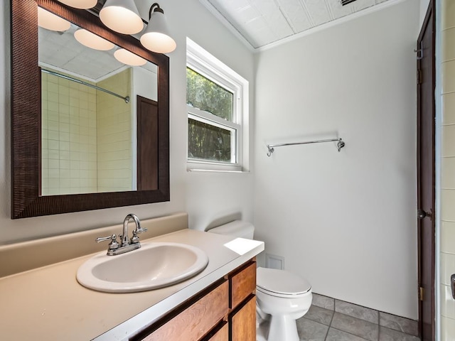 bathroom with vanity, tile patterned flooring, toilet, and walk in shower