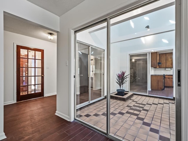 entryway with dark hardwood / wood-style flooring