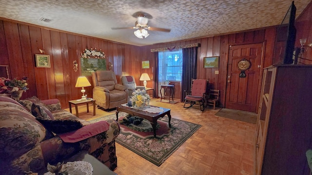 living room featuring light parquet floors and ceiling fan