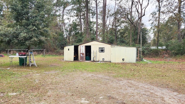 view of outdoor structure with a yard