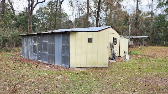 view of outdoor structure with a yard