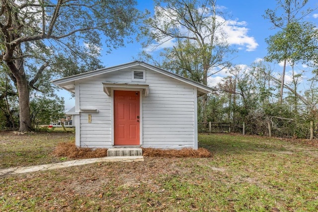 exterior space with an outbuilding and a front yard