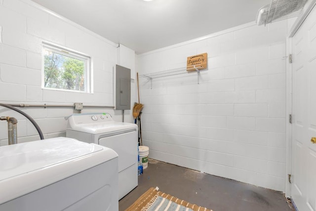 washroom with independent washer and dryer and electric panel