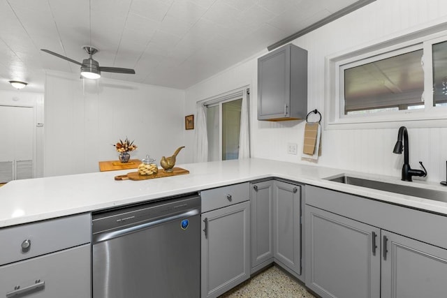 kitchen with ceiling fan, gray cabinets, stainless steel dishwasher, kitchen peninsula, and sink