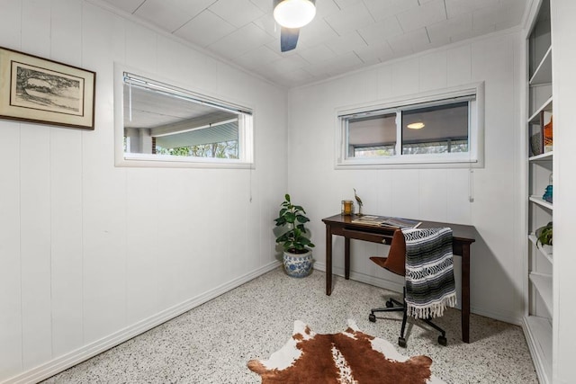 office space with ceiling fan and crown molding