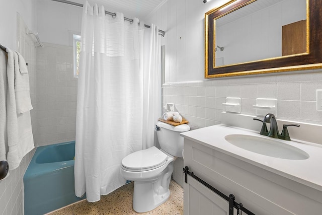 full bathroom featuring toilet, tile walls, shower / bath combo, and vanity