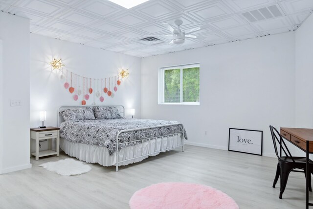 bedroom with ceiling fan and light hardwood / wood-style floors