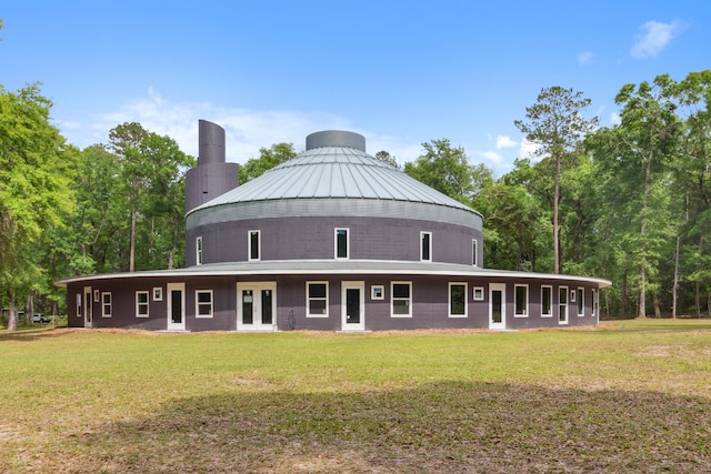 view of front of property featuring a front lawn and a gazebo