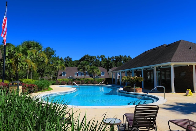 view of swimming pool with a patio