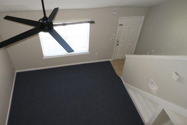 tiled spare room with ceiling fan