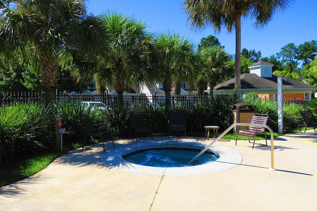 view of pool featuring a hot tub