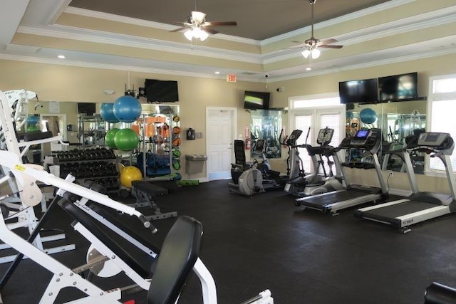 exercise room with french doors, ceiling fan, ornamental molding, and a tray ceiling