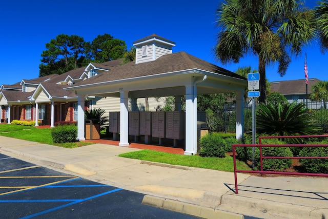 surrounding community with a gazebo and mail boxes