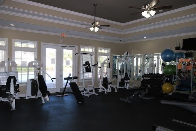 gym with ornamental molding, a raised ceiling, and ceiling fan