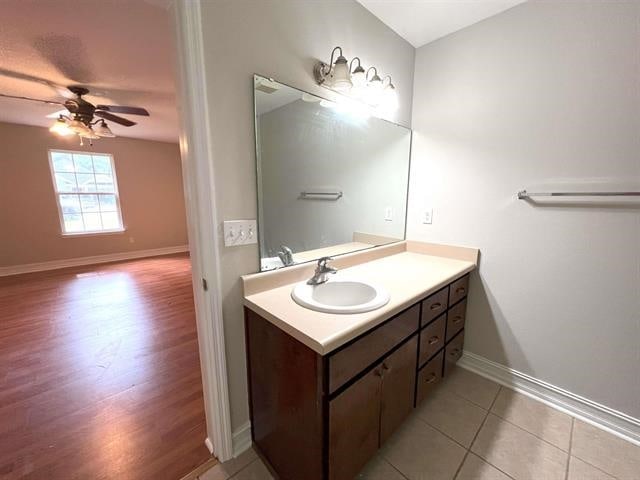 29 Chippewa Rd, Crawfordville, FL 32327 - bathroom with a ceiling fan, vanity, and wood finished floors