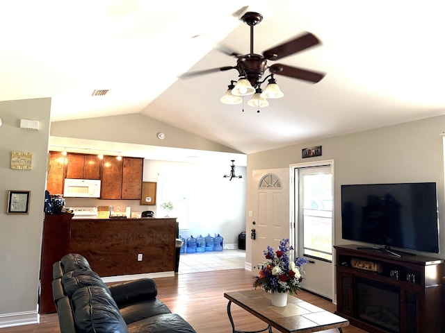 29 Chippewa Rd, Crawfordville, FL 32327 - living room featuring lofted ceiling, light wood-style flooring, and ceiling fan