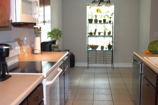 29 Chippewa Rd, Crawfordville, FL 32327 - kitchen with white appliances, light countertops, and light tile patterned flooring