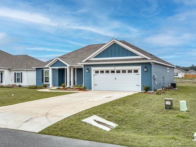 ranch-style house with a garage, concrete driveway, board and batten siding, and a front yard