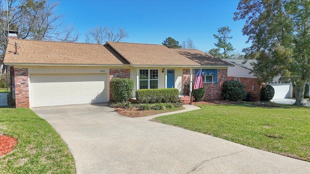 ranch-style home featuring an attached garage, brick siding, concrete driveway, a chimney, and a front yard