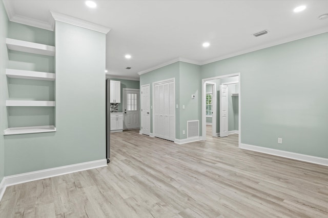unfurnished living room with crown molding, light wood-style floors, recessed lighting, and visible vents