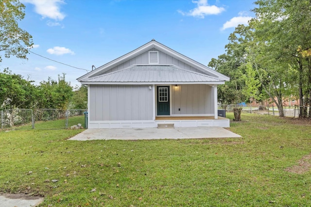 back of property featuring a fenced backyard, a patio, and a yard