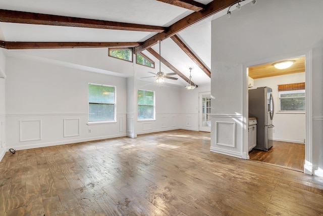 3200 Tallavana Trl, Havana, FL 32333 - unfurnished living room featuring ceiling fan, hardwood / wood-style flooring, a wainscoted wall, a decorative wall, and healthy amount of natural light