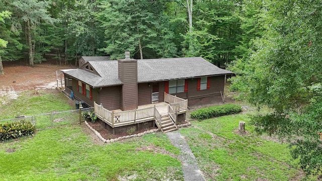 3200 Tallavana Trl, Havana, FL 32333 - rustic home with a chimney, covered porch, roof with shingles, and a forest view