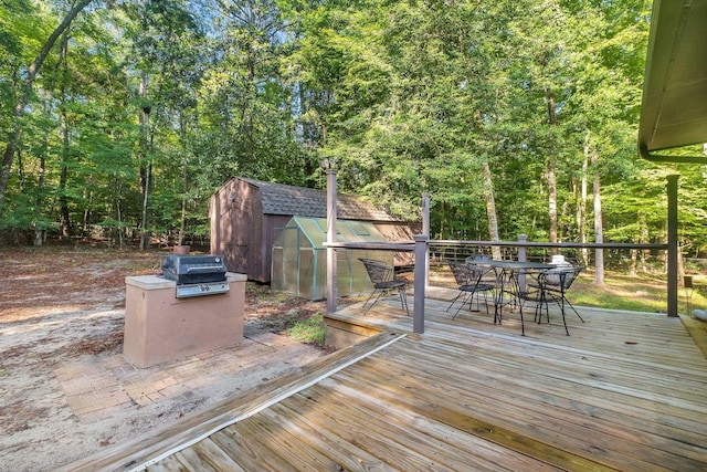 3200 Tallavana Trl, Havana, FL 32333 - wooden terrace featuring outdoor dining area, a storage shed, and area for grilling