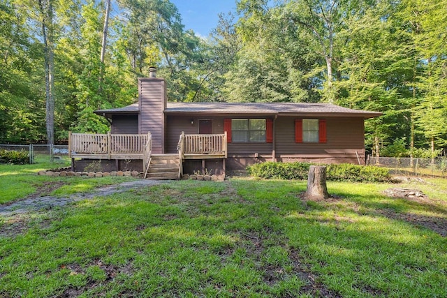 3200 Tallavana Trl, Havana, FL 32333 - rear view of property with a chimney, a deck, and a view of trees