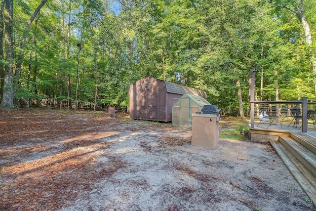 3200 Tallavana Trl, Havana, FL 32333 - view of yard with a shed, a deck, and a forest view