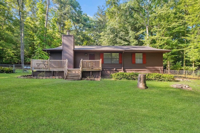 3200 Tallavana Trl, Havana, FL 32333 - back of property with a chimney and a wooden deck