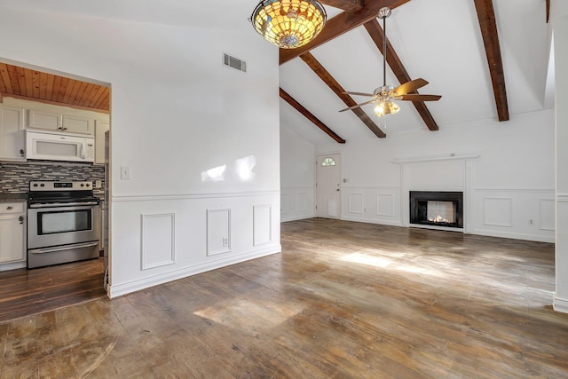 3200 Tallavana Trl, Havana, FL 32333 - unfurnished living room featuring a ceiling fan, dark wood-style flooring, wainscoting, a lit fireplace, and a decorative wall
