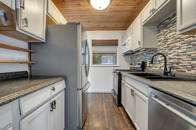 3200 Tallavana Trl, Havana, FL 32333 - kitchen featuring stainless steel appliances, dark wood-style floors, wooden ceiling, decorative backsplash, and white cabinetry
