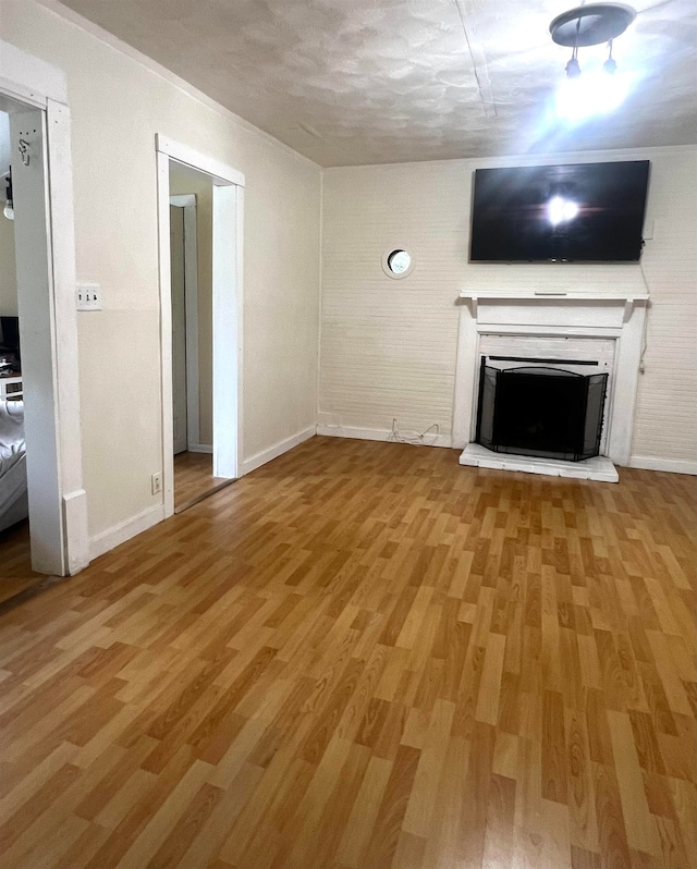 unfurnished living room with hardwood / wood-style floors