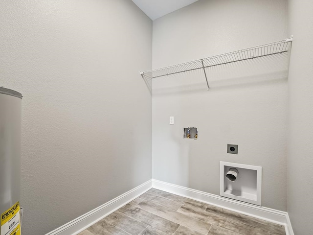 laundry room with washer hookup, gas water heater, electric dryer hookup, and light hardwood / wood-style floors