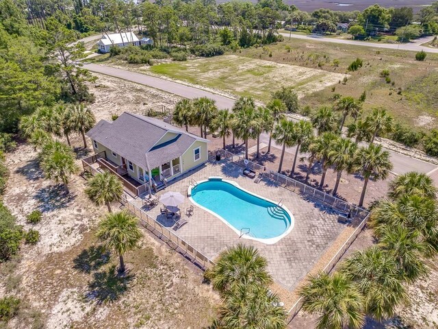 240 Ante Beppum Loop, Carrabelle, FL 32322 - aerial view of property and surrounding area with a pool and a tree filled landscape