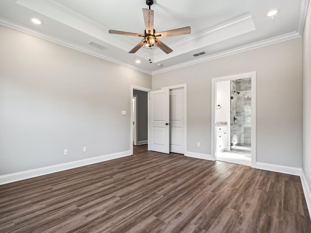 unfurnished bedroom featuring crown molding, ensuite bath, ceiling fan, and dark hardwood / wood-style floors