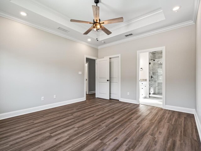 240 Ante Beppum Loop, Carrabelle, FL 32322 - unfurnished bedroom with a tray ceiling, dark wood-type flooring, baseboards, ornamental molding, and recessed lighting