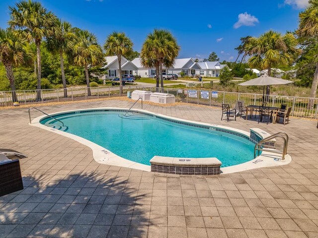 240 Ante Beppum Loop, Carrabelle, FL 32322 - community pool with a patio area and a residential view