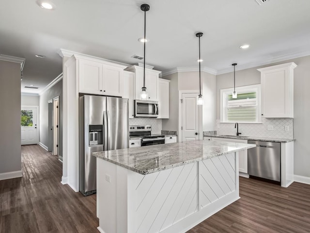 240 Ante Beppum Loop, Carrabelle, FL 32322 - kitchen featuring stainless steel appliances, a sink, white cabinets, backsplash, and crown molding