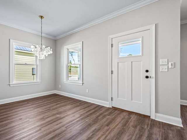 entrance foyer featuring plenty of natural light, dark hardwood / wood-style floors, and crown molding