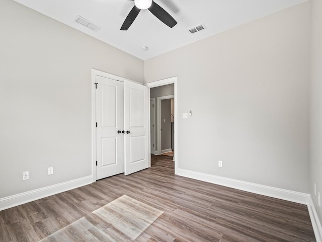 unfurnished bedroom featuring light wood-type flooring and ceiling fan